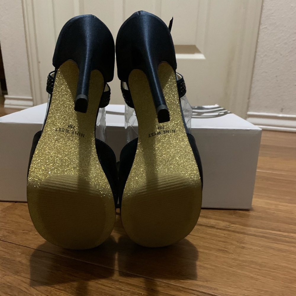 Nine West black satin platform heels.